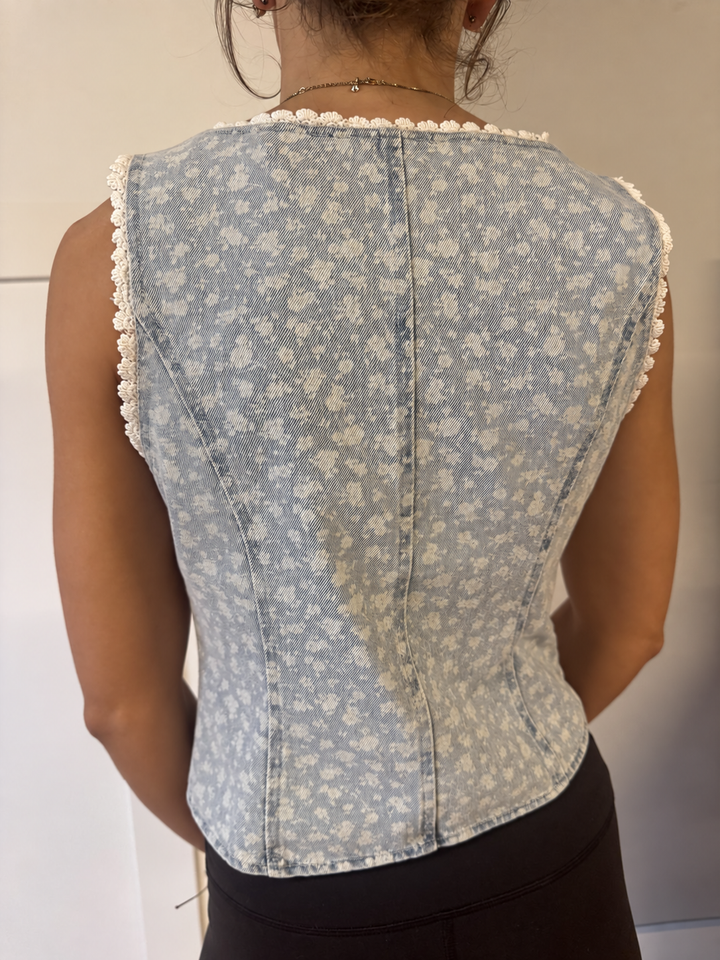 ￼ Faded floral denim vest ￼